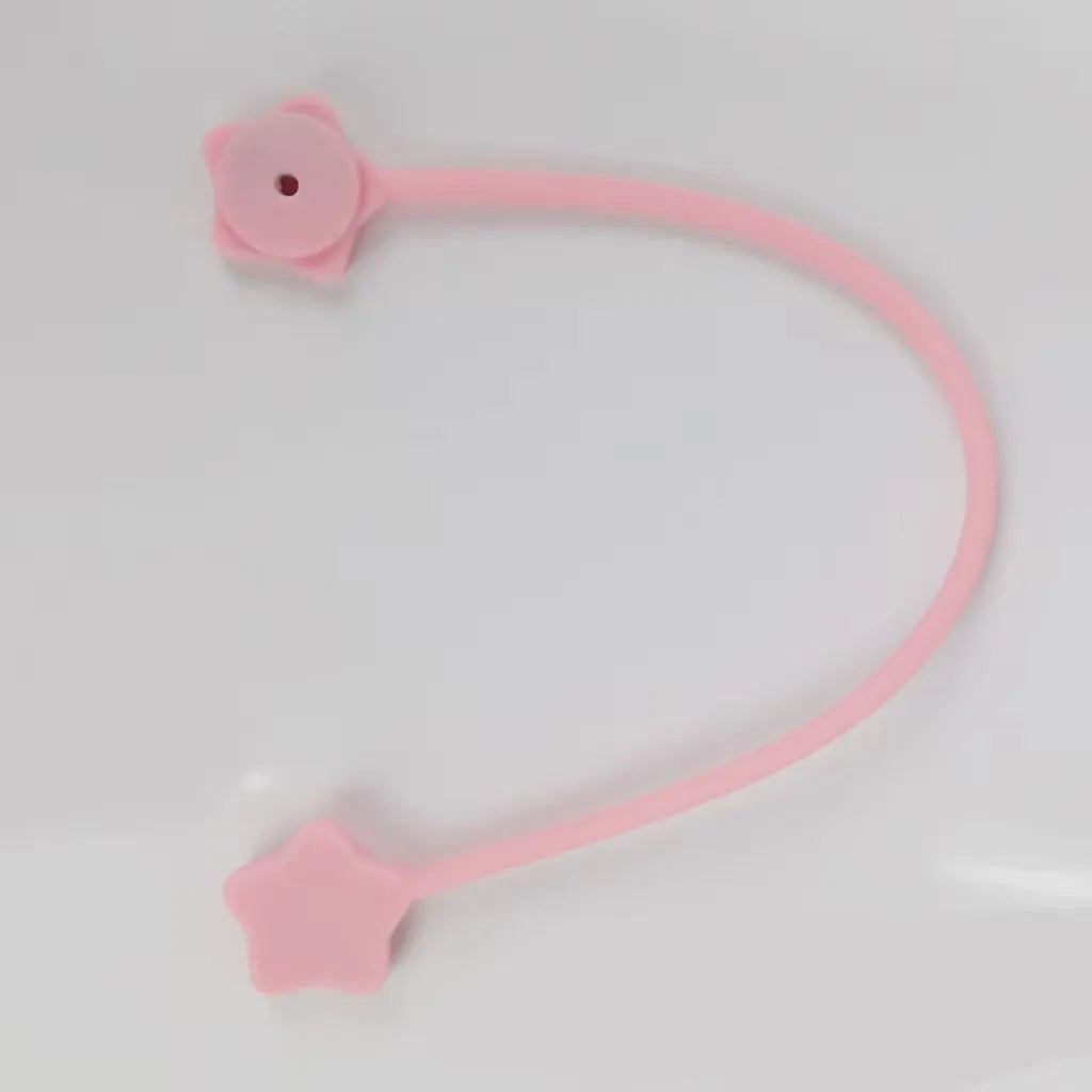 Small purple silicone wire winder with magnet for organising headphone cables.