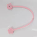 Small purple silicone wire winder with magnet for organising headphone cables.