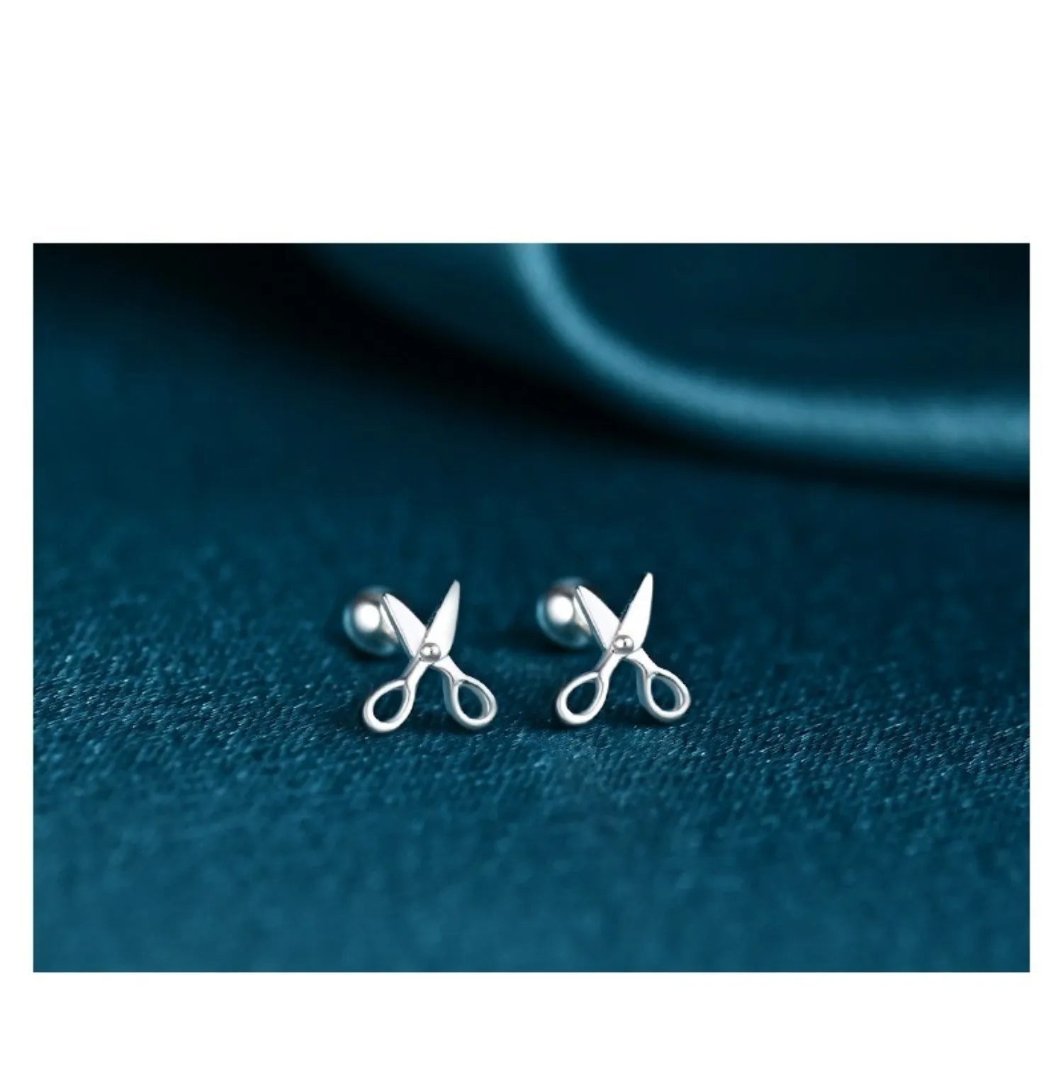 Pure silver screw-back ear nails featuring a miniature scissors charm