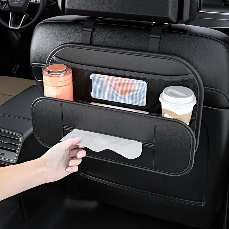 Black leather storage bag attached to the back of a car seat for organisation.