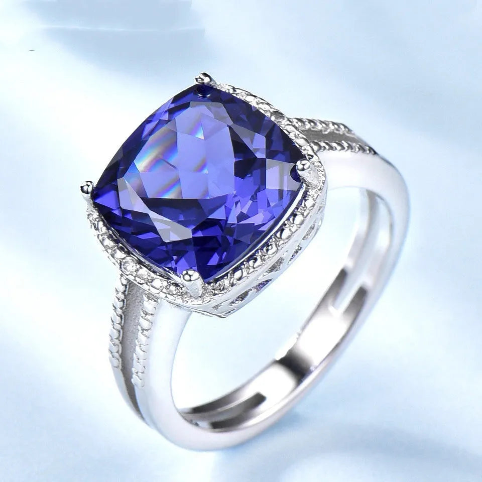Close-up of a blue tanzanite stone set in a sterling silver women's ring.