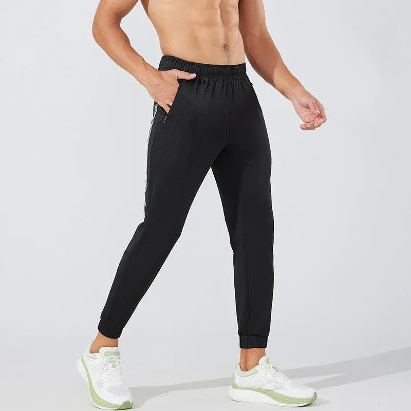 Men's black running trousers with mid waist design for exercise and casual wear