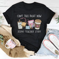 Black loose fit cotton t-shirt with round neck and short sleeves on a hanger