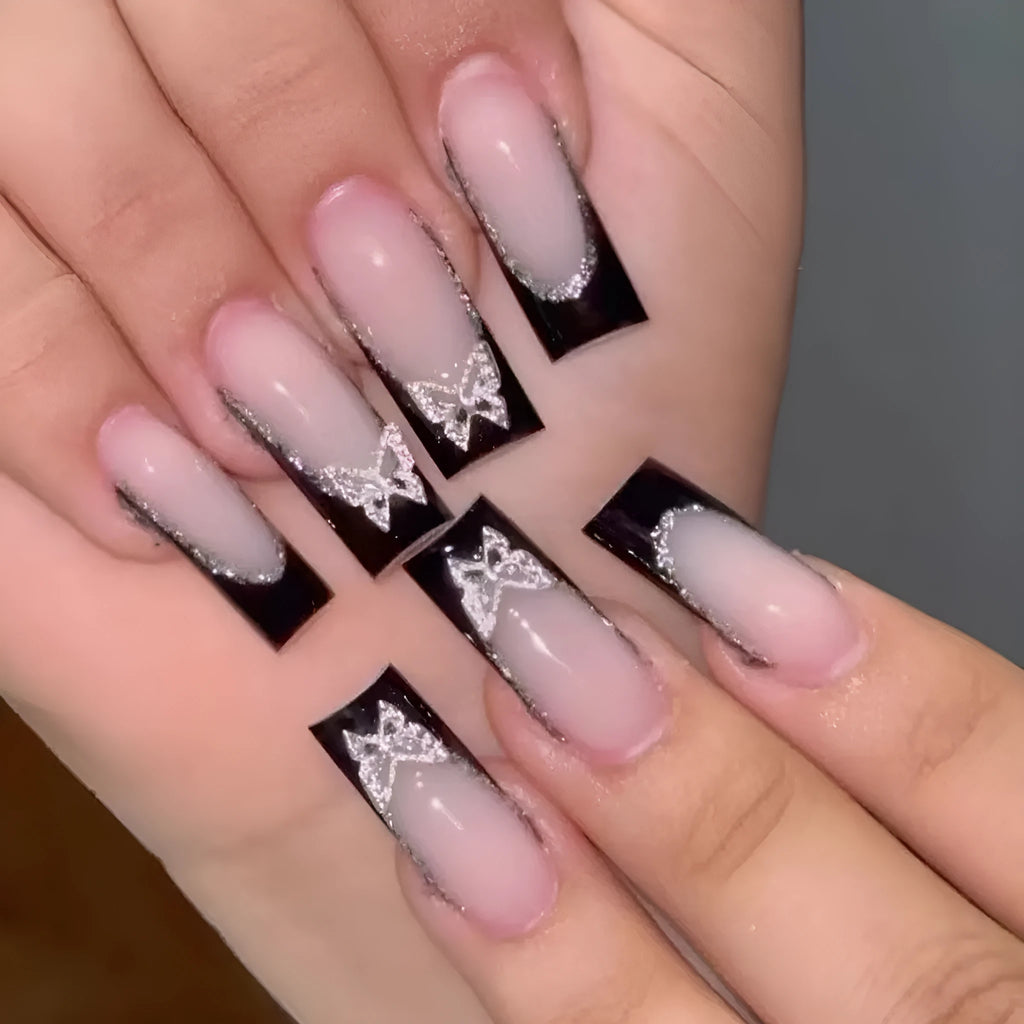 Black French style glitter butterfly nail wear armor set on a nail, showing yellow and black jelly glue colour options.