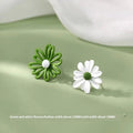 Flower-shaped alloy stud earrings in three colour combinations: blue-orange, white-green, and yellow-white