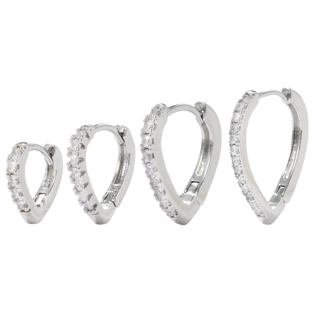Geometric heart-shaped ear clips in gold and white colours on copper with clip back
