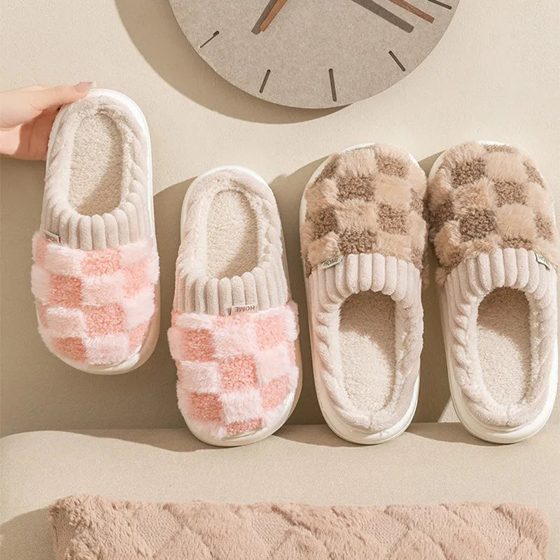 Women's plaid patterned plush slippers with a non-slip PVC sole, shown in a selection of colours including coffee, green, and pink.