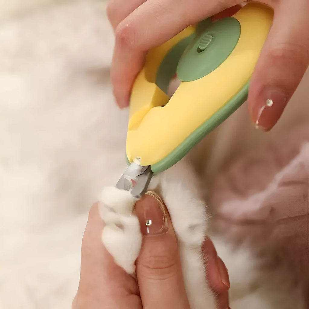 Professional pet nail clipper with LED light and soft grip handles for small dogs and cats.