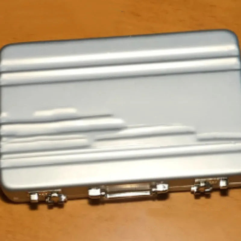 Slim aluminium alloy metal card holder in six colour options showing 100x65x16mm dimensions.