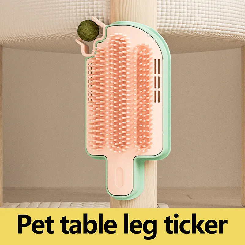 Ice cream cone shaped cat grooming toy with mint ball and feather attachments on textured surface