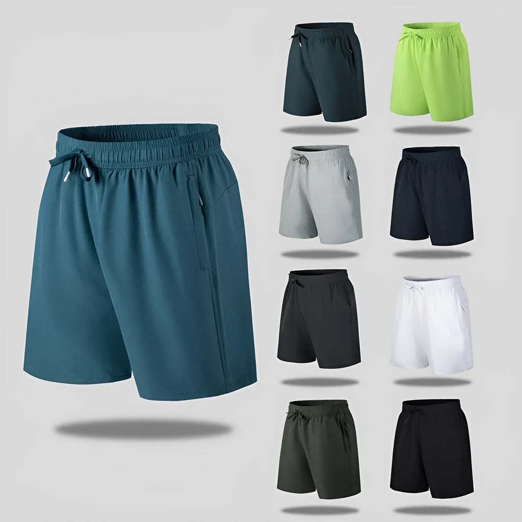 Man wearing loose light grey quick-dry polyester beach shorts on summer day