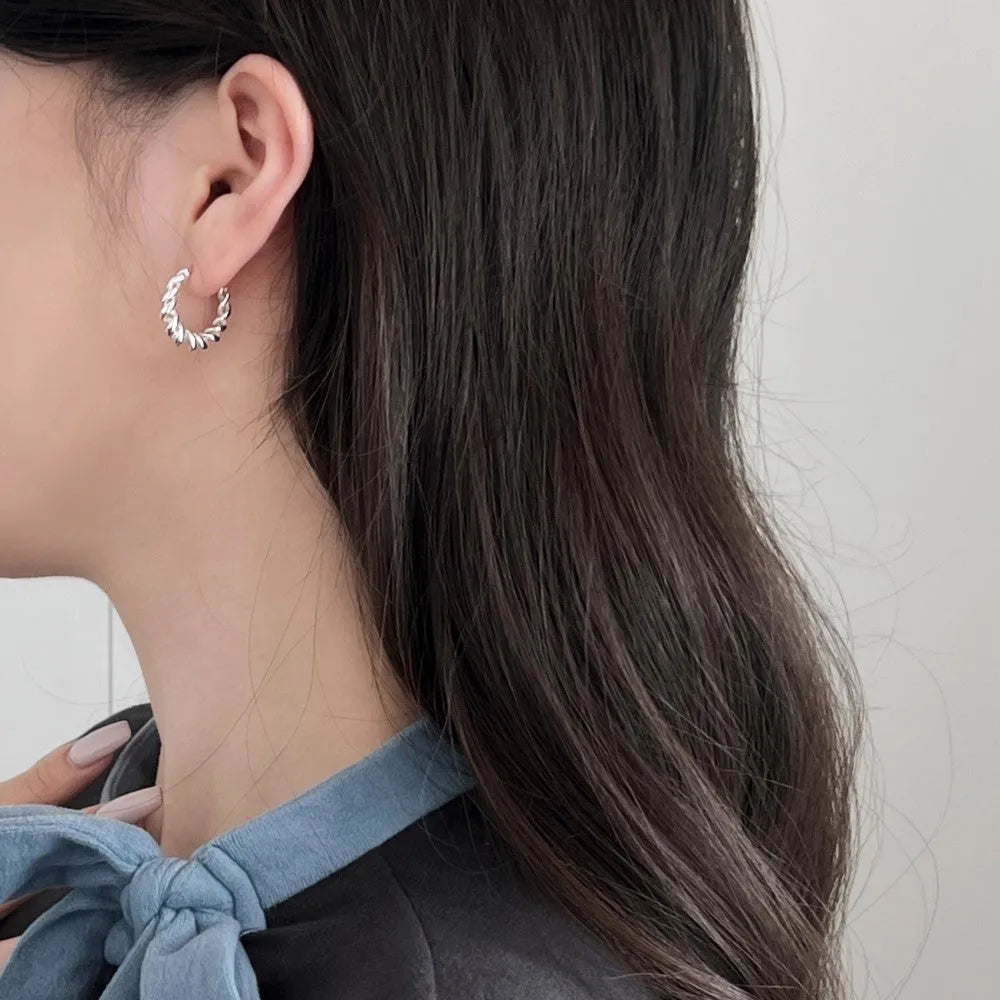 Argent Pur 925 silver ear studs with electroplated silver finish on a neutral background