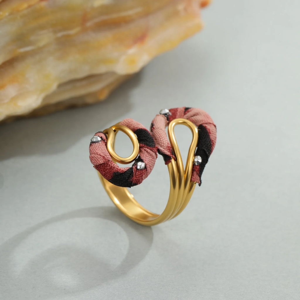 Stainless steel open mouth ring with leopard print geometric shapes in multiple colour options
