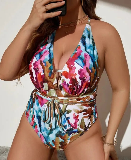 Women's solid colour one-piece halter swimsuit in purple or blue with briefs cut
