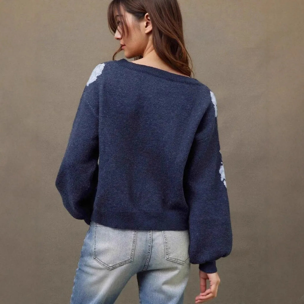 Sapphire blue women's loose pullover with woven floral jacquard pattern and off-neck design.