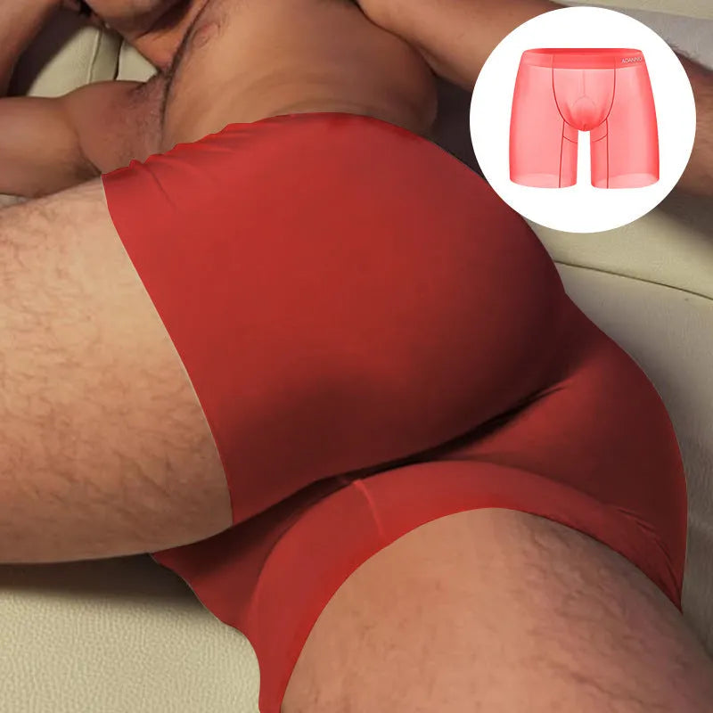 Seamless low-waist men's nylon boxers in orange, shown flat, highlighting the convex seam and sports design.