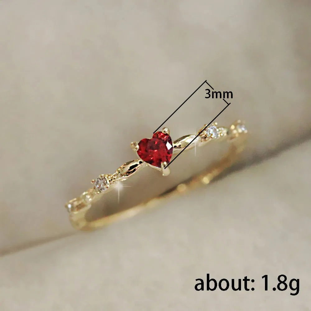 Zircon peach heart ring in gold or silver electroplated finish on copper, shown in UK sizes 6-10