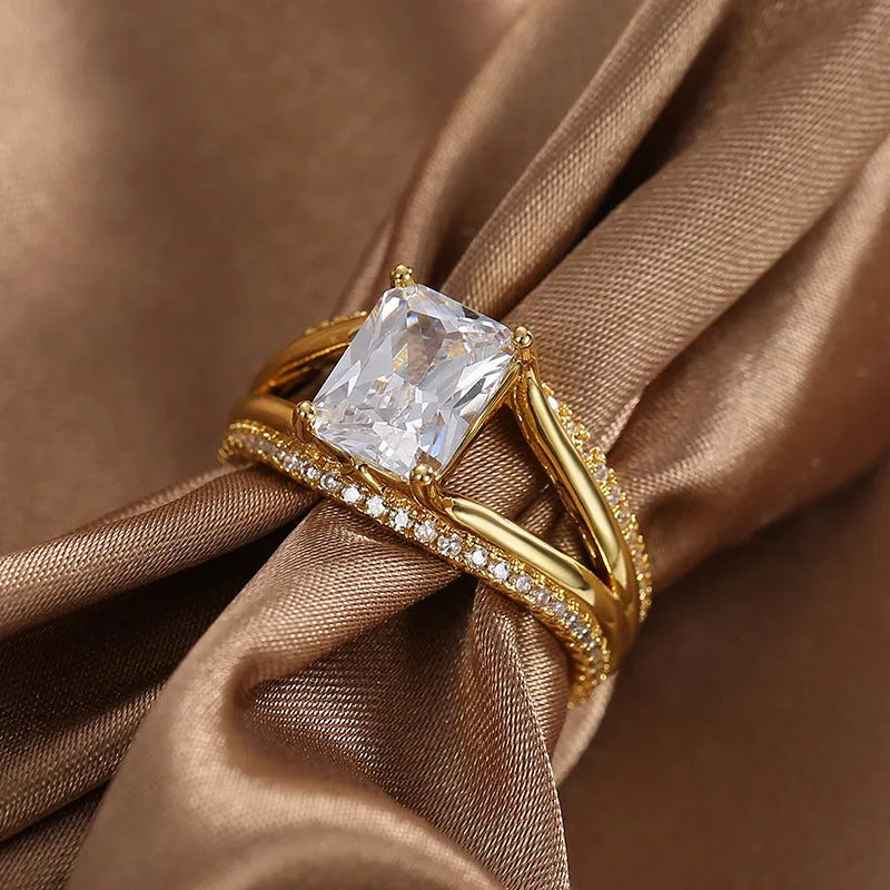 Gold coloured geometric women's ring with square zircon detailing on copper with electroplated finish