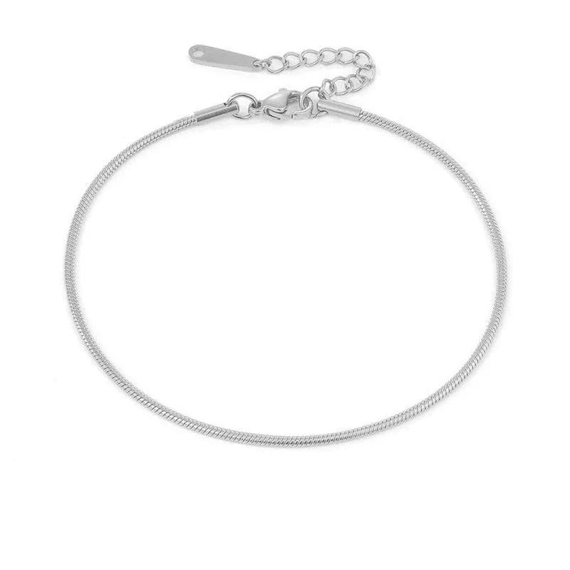 Stainless steel snake chain anklet with adjustable extender in gold colour on a white background