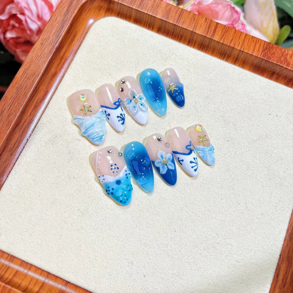 Blue hand-painted carved summer ice transparent plastic fake nails with dimensional design