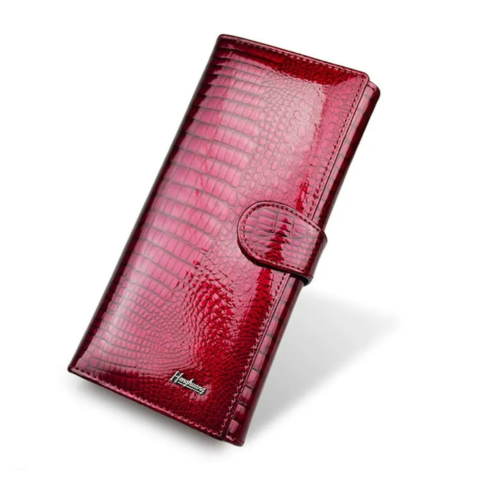 Women's leather coin purse with patent finish and crocodile pattern in red, wine red, and black colour options