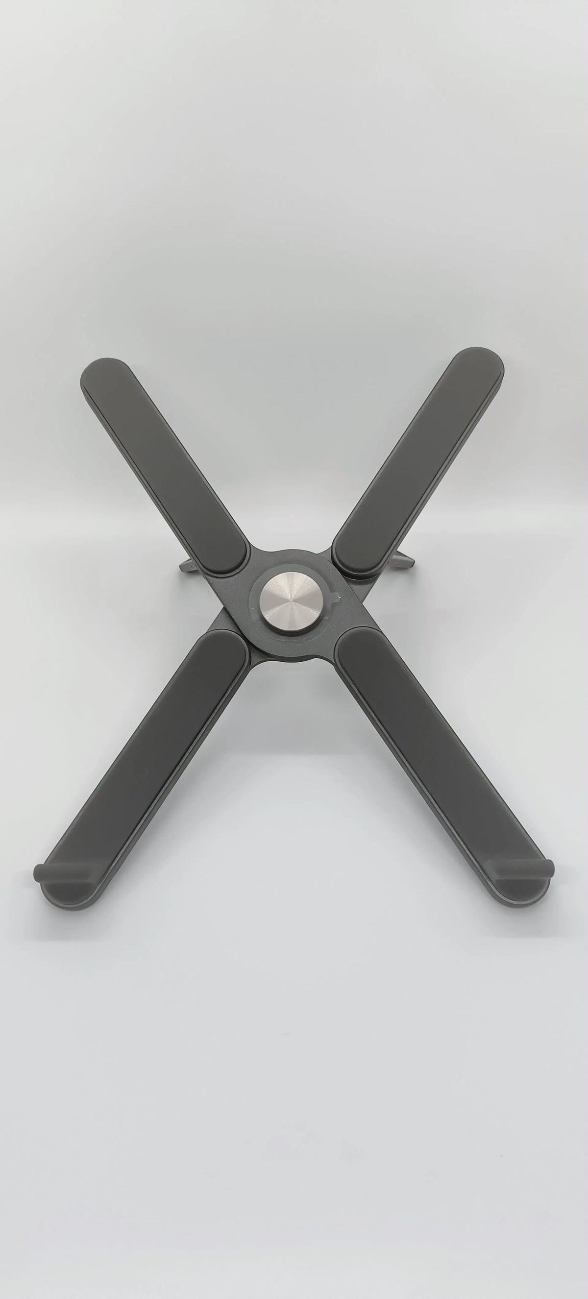 Foldable aluminium alloy laptop stand with 280mm base plate in silver or black, folded size 280 x 23.5 x 46.5mm.