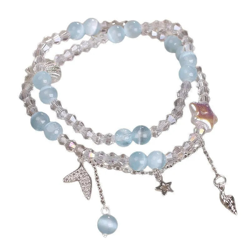 Light blue double circle aquamarine bracelet for women with two interlocking rings.