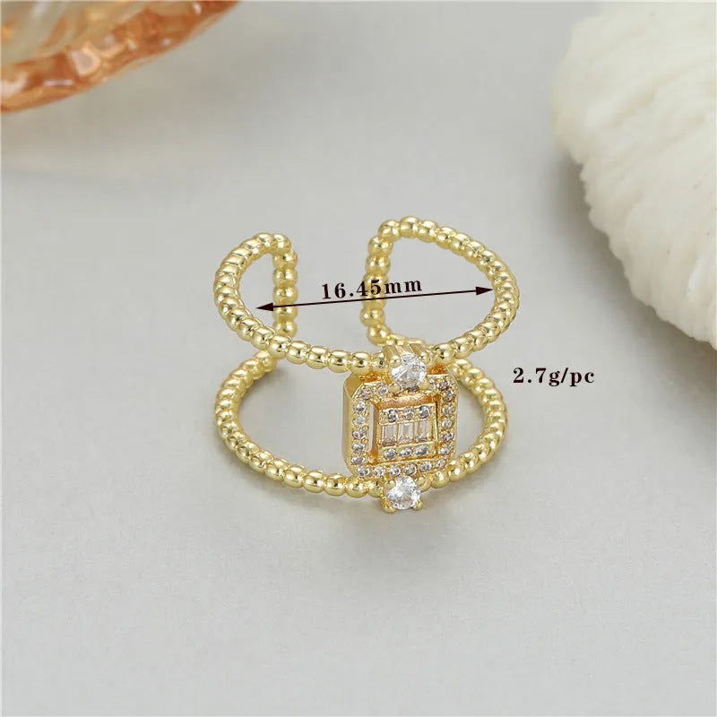 Adjustable copper open ring with asymmetrical U-shape in gold tone colour H-12813.