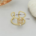 Adjustable copper open ring with asymmetrical U-shape in gold tone colour H-12813.