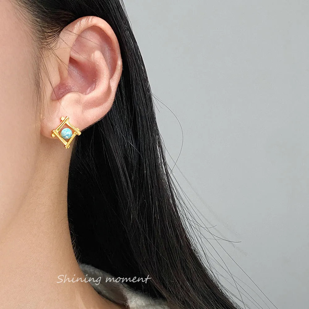 Women's geometric cross shaped stud earrings in 925 sterling silver with a choice of gold or silver finish.