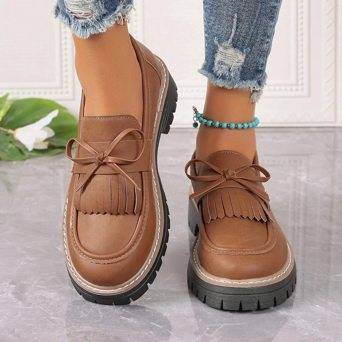 Plus size women's loafers with chunky heel in black and brown colours showing round toe design