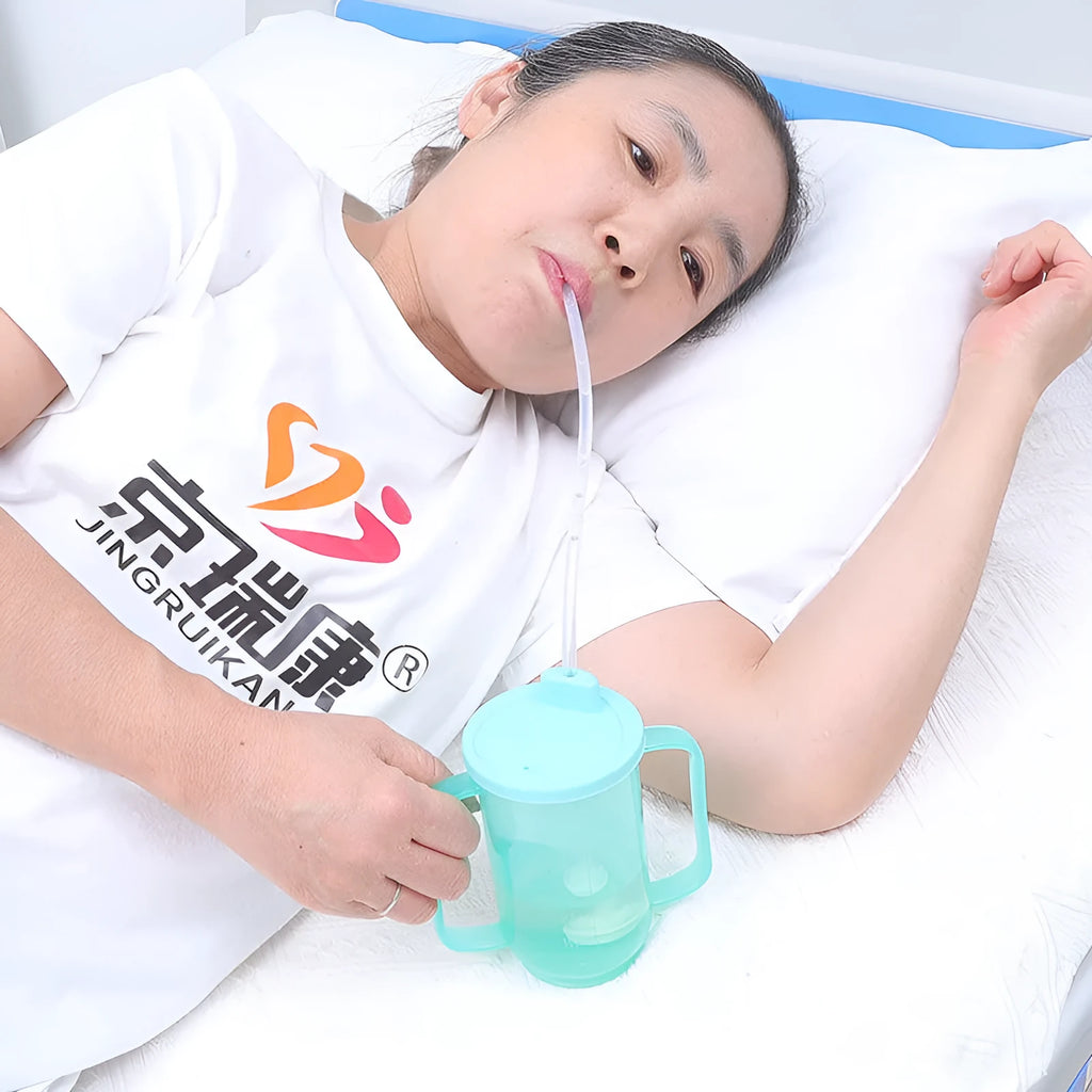 Angled spout choke-proof drinking cup with handle and lid for bed-bound users