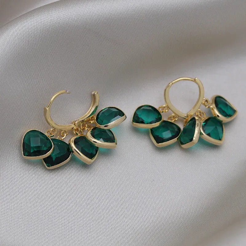 Korean style green glass heart-shaped ear clip earrings with alloy and artificial gemstone inlay.