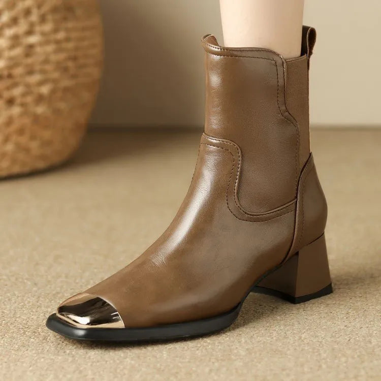 Brown cowhide leather women's ankle boots with a high heel and side zipper closure on a white background.