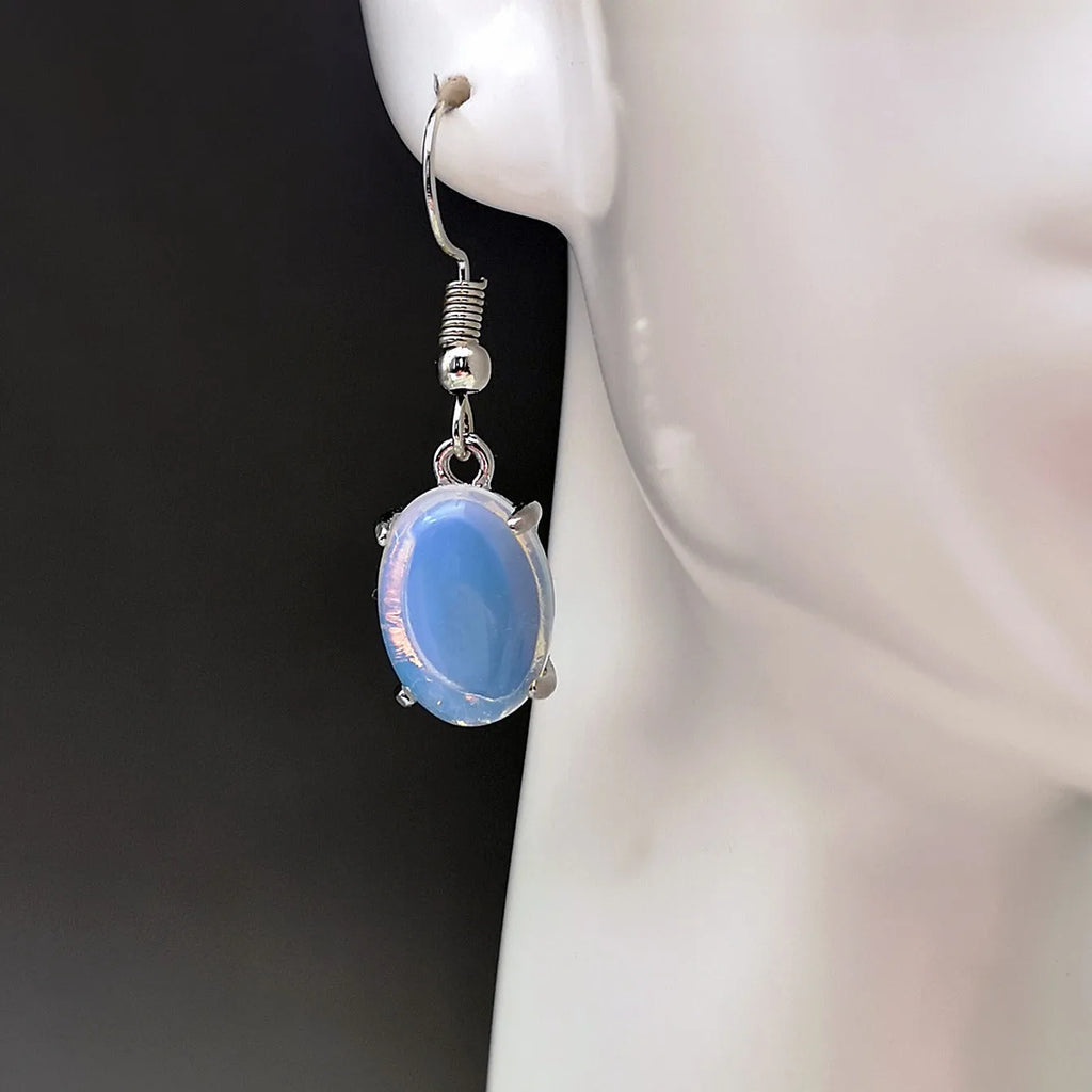 Moonlight white opal drop earrings with retro cross and ellipse design on alloy.