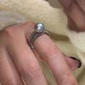 Geometric open copper ring for women with adjustable opening on an index finger.