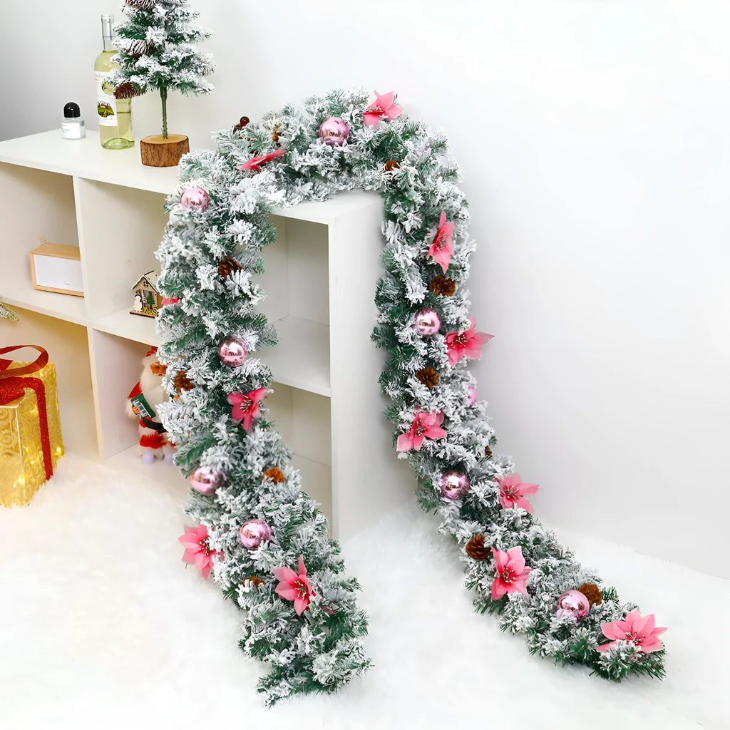 A long, flocked golden rattan Christmas garland draped in a swag on a mantelpiece.