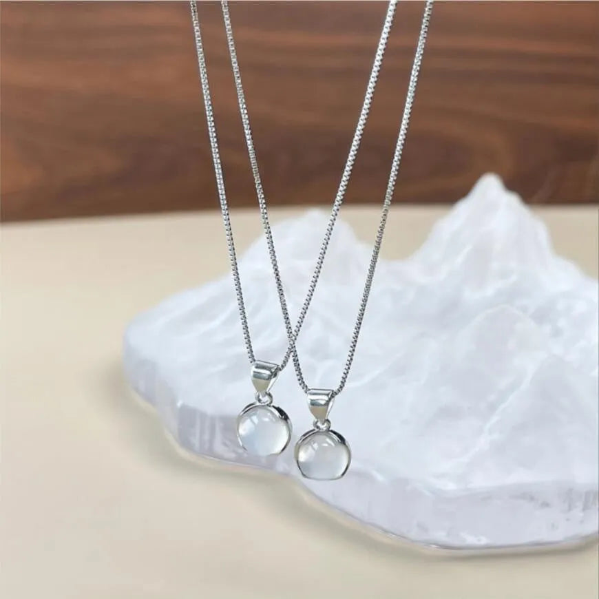 Oval artificial crystal pendant necklace with eight-point star design on adjustable box chain
