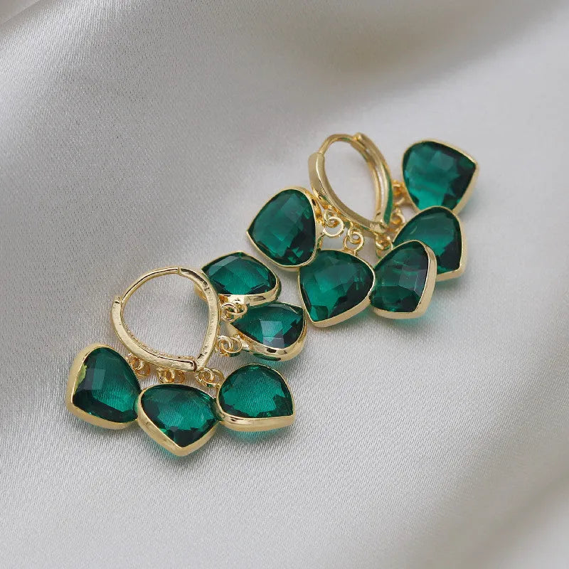 Korean style green glass heart-shaped ear clip earrings with alloy and artificial gemstone inlay.