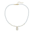 White necklace with a natural shell-shaped mother of pearl pendant on a metal chain.