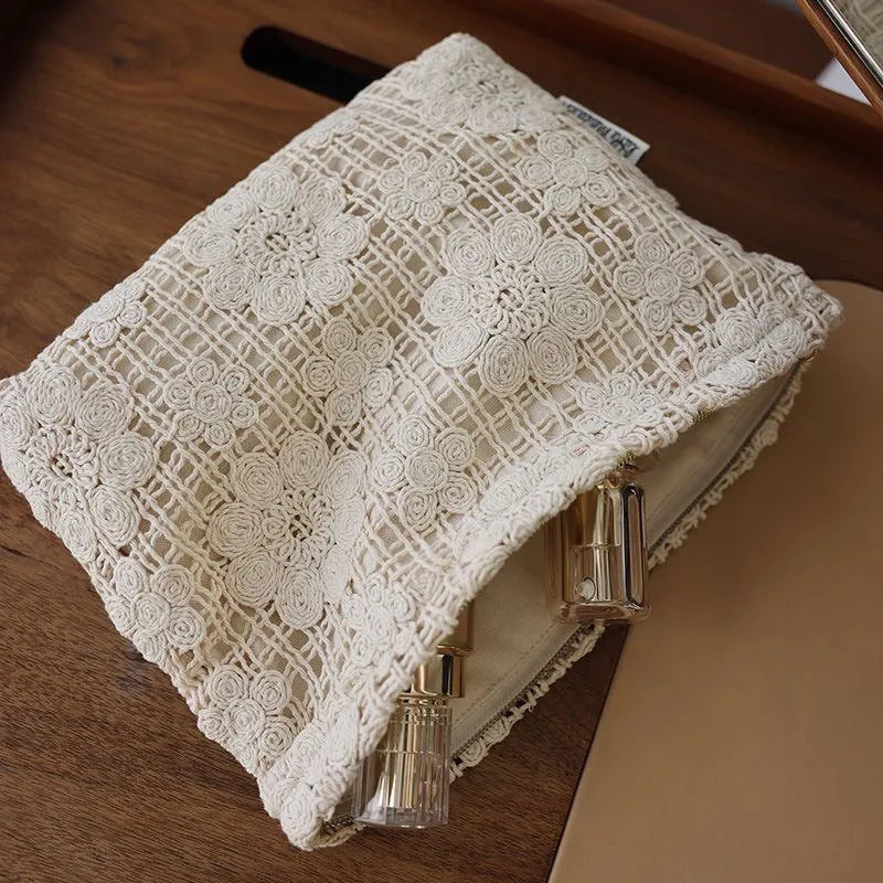 Handmade corduroy cosmetic bag with crocheted hollow flower pattern and ethnic embroidery in solid colour rope style