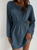 Blue women's knitted dress with hand-crocheted flowers, fitted waist, and round neck.