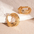 Women's geometric hollow stud earrings with twisted round shapes in gold and silver plating