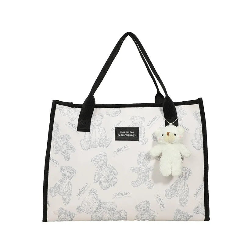 Women's black canvas tote bag with rhombus pattern and sandwich pocket