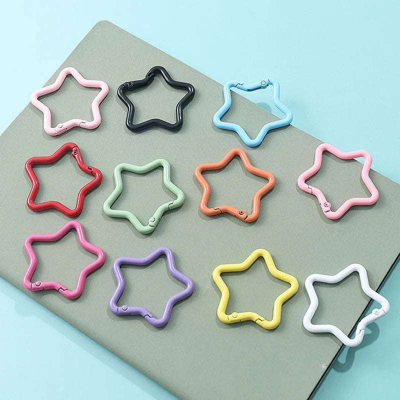 Zinc alloy five-pointed star keychain in macaron colours like light pink and green.