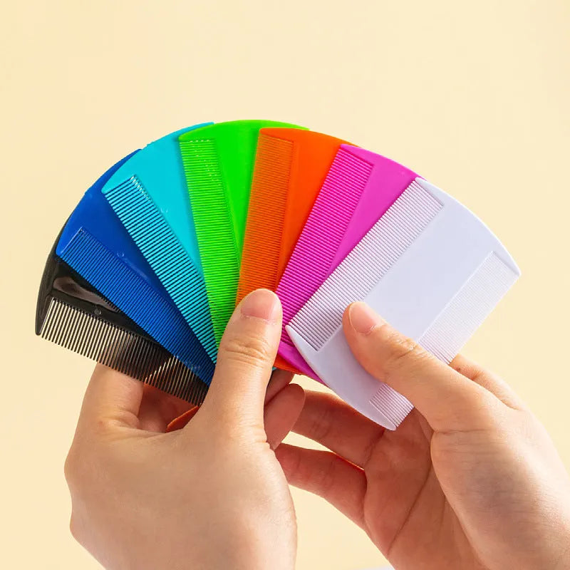 Double-edged fine-toothed plastic lice comb in assorted colours on white background
