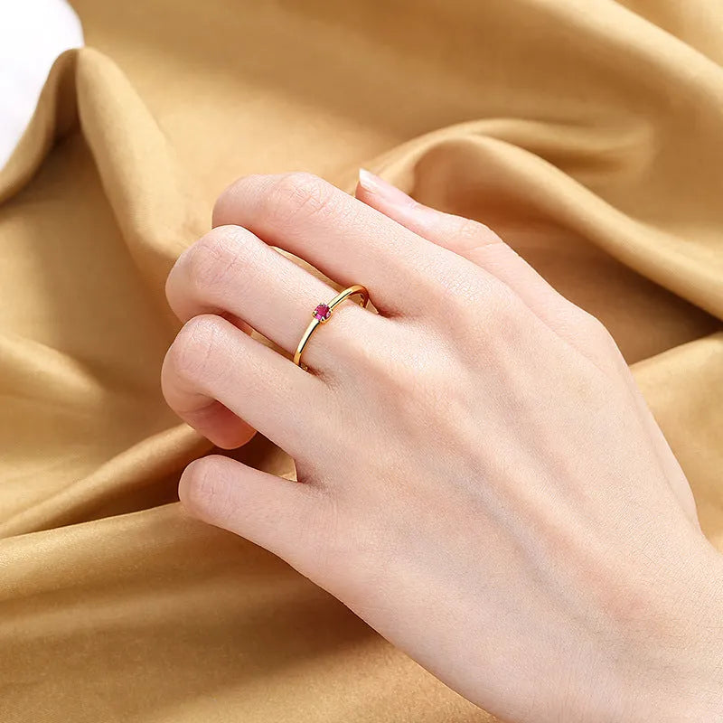 Copper geometric circle women's ring with a single diamond, shown in blue, green, red, and white colour options.