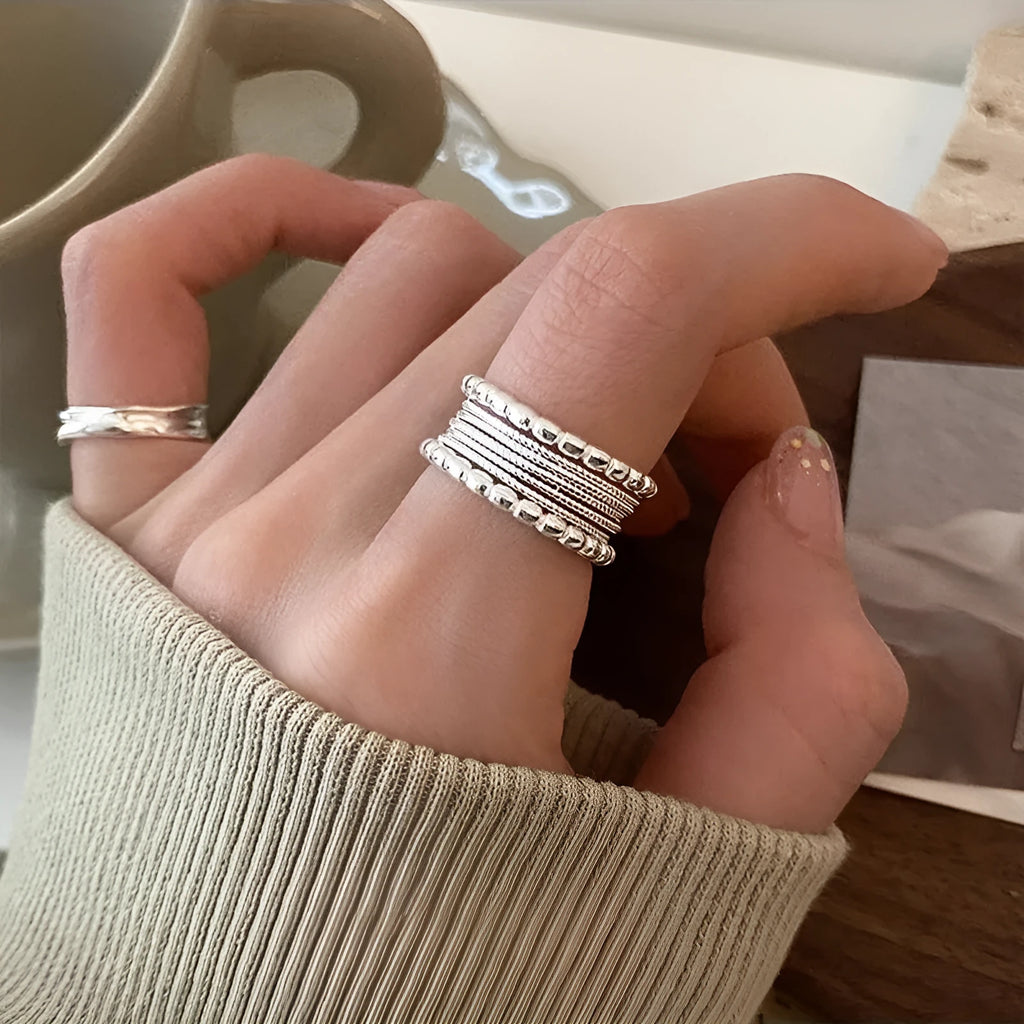 Adjustable copper alloy ring with woven twisted multilayer geometric design