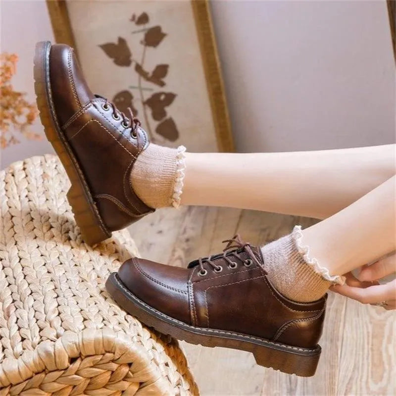 Women's black retro college-style Mary Jane shoes with square low heel and front lace-up closure