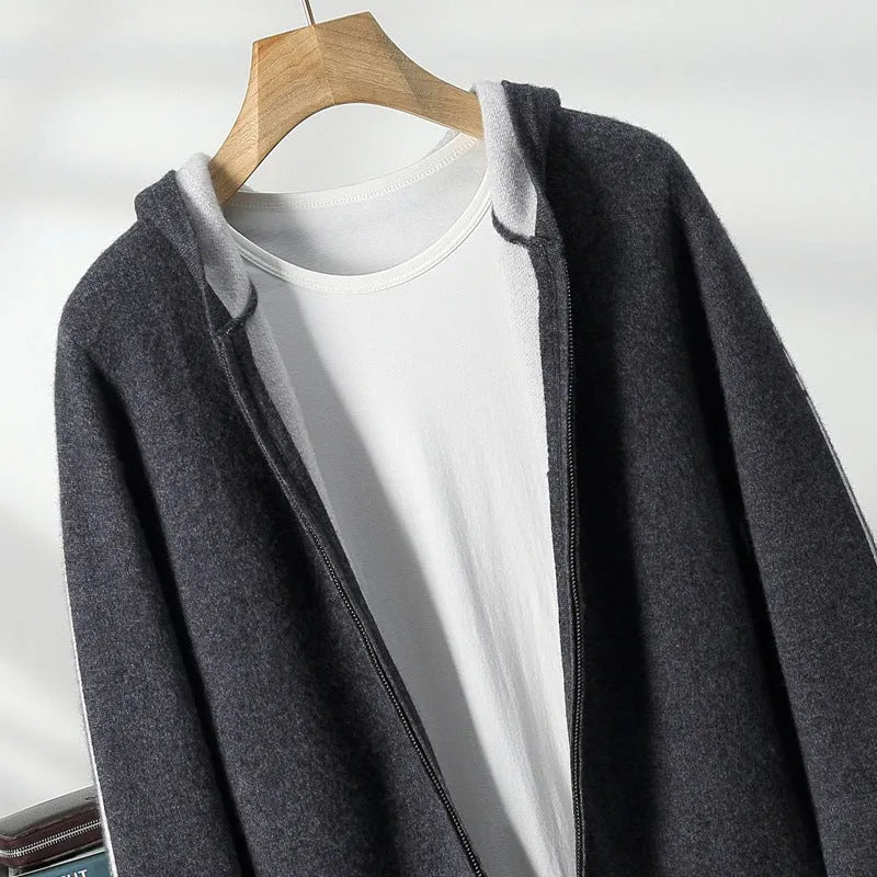 Man wearing a dark blue cashmere cardigan with a half-high collar and front zipper.